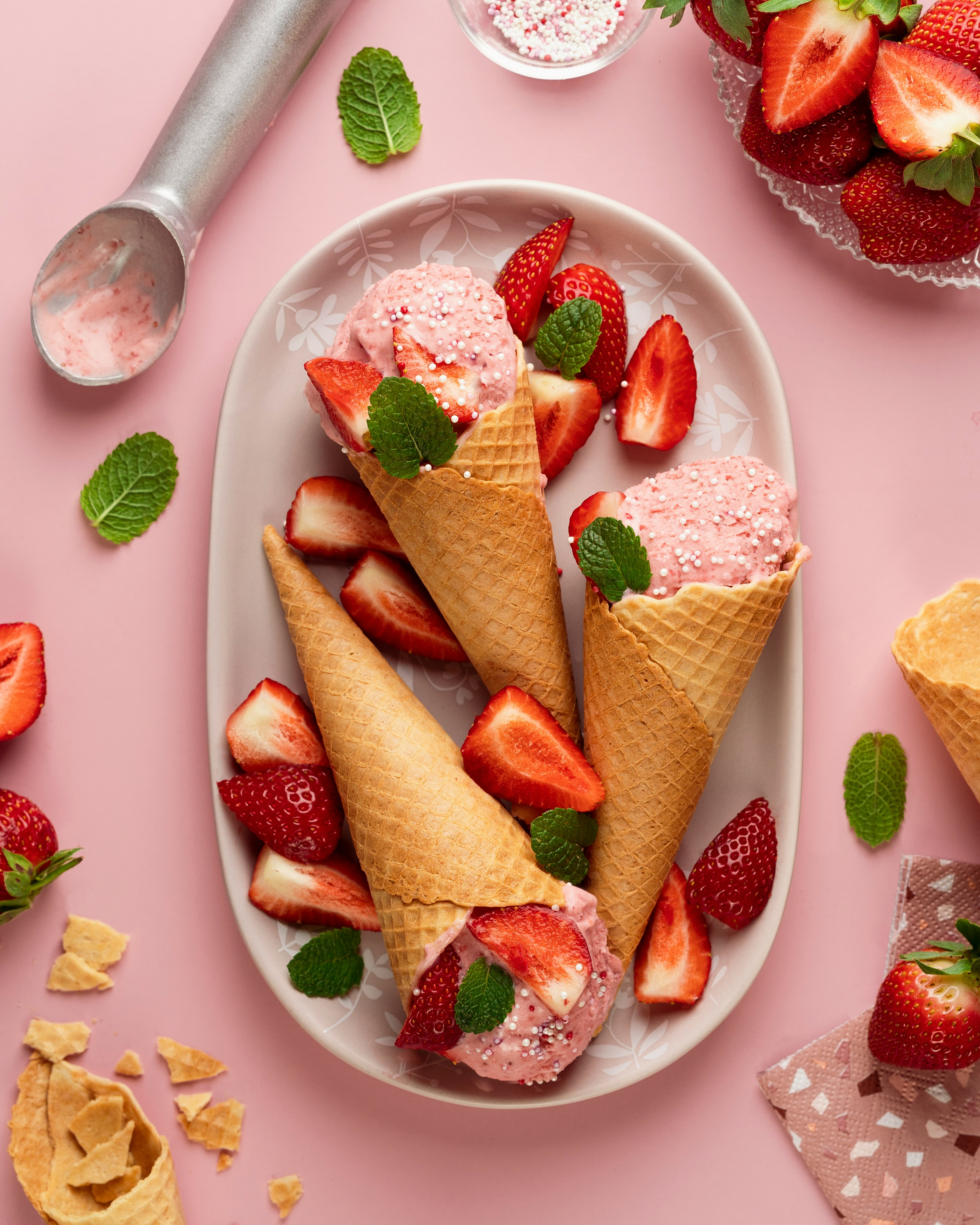 Fresh strawberry ice cream in waffle cones